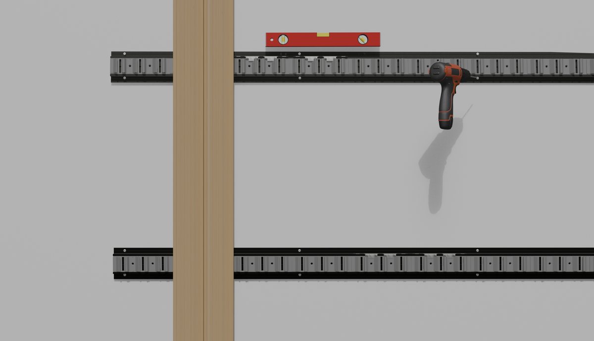Rails on the wall with a spirit level and a drill